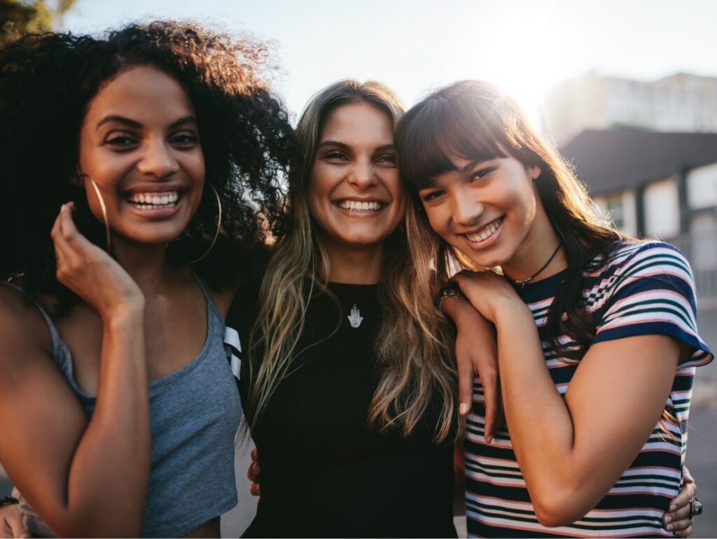 Group of friends smiling outdoors
