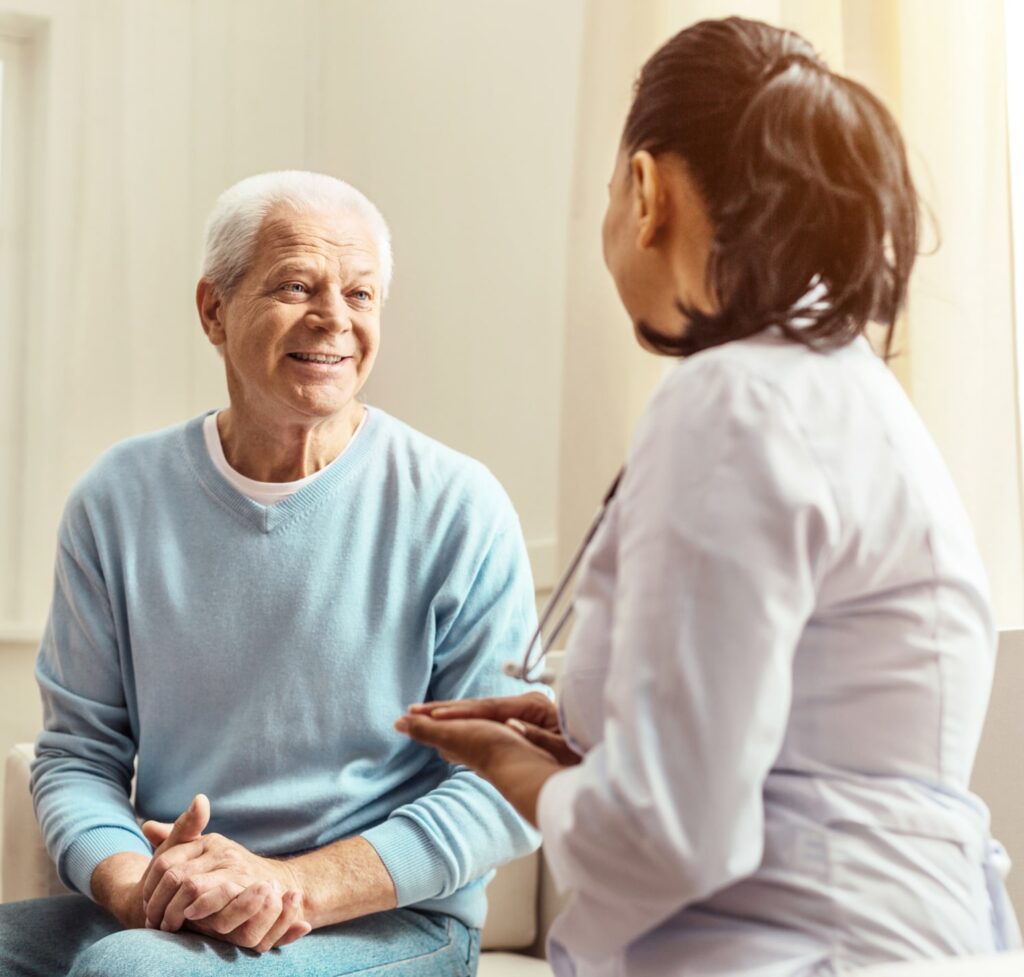 Medicare Advantage - HealthyU Clinics Pleasant elderly man having a conversation with doctor