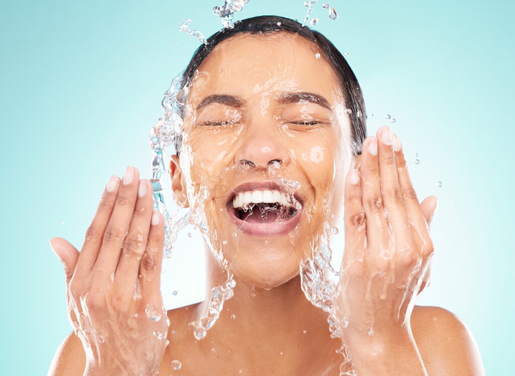 Shot of Young Woman Washing Face