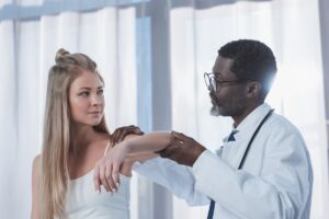 Doctor gives years physical exam to patient