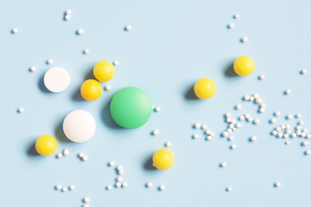 Various Pills On A Blue Background