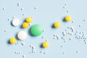 Various Pills On A Blue Background